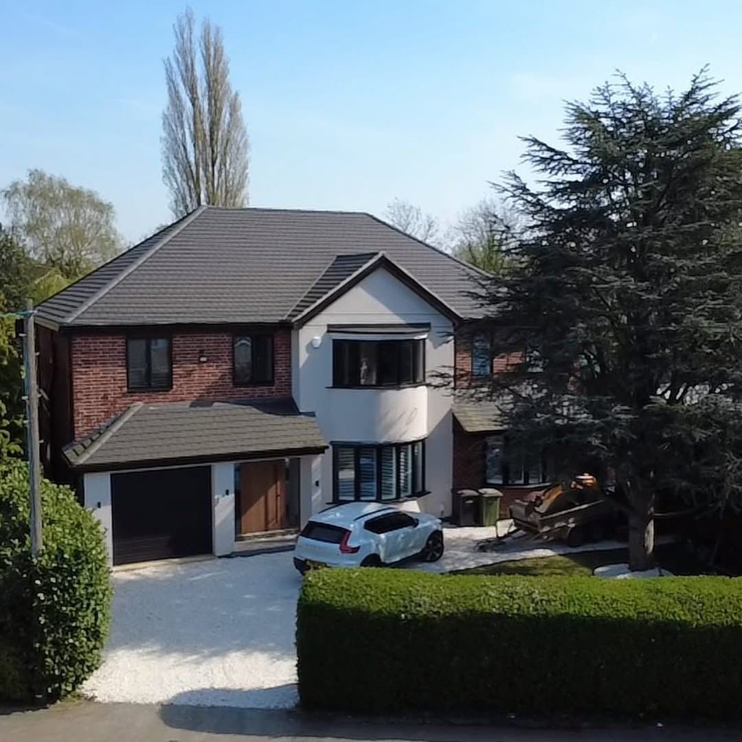 Modern detached house with a new driveway and front garden